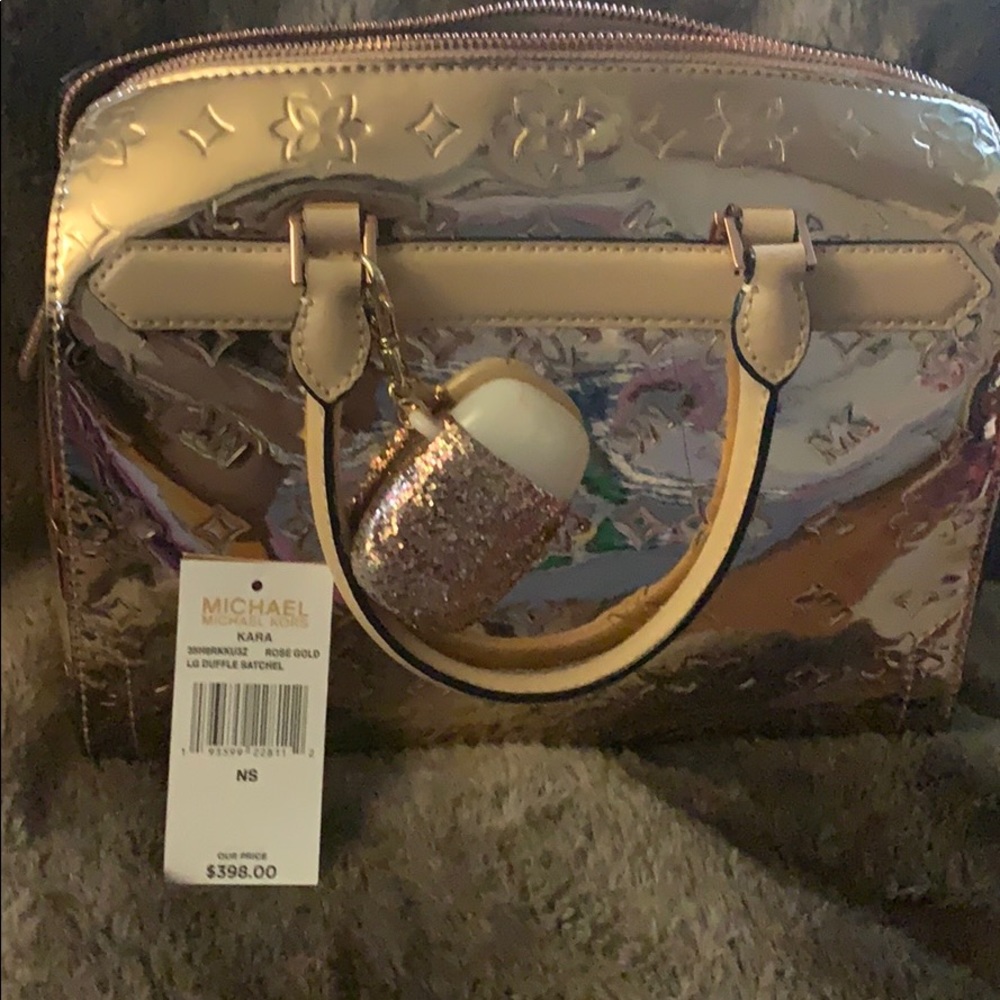 Michael Kors Rose gold large Duffel satchel “Kara”